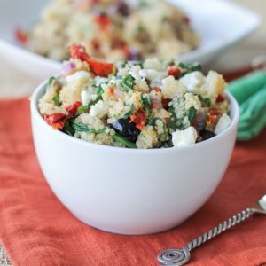 Mediterranean Quinoa Salad with spinach, kalamata olives, sun-dried tomatoes, feta, and lemon vinaigrette - a healthy vegetarian meal or side dish!
