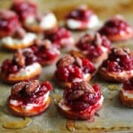 Sweet Potato Rounds with Goat Cheese, Roasted Cranberries, @bluediamond almonds, and honey TheRoastedRoot.net #healthy #appetizer