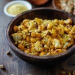 "Cheesy" Vegan Roasted Cauliflower with Nutritional Yeast | TheRoastedRoot.net #healthy #recipe #vegetarian #glutenfree