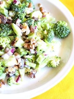 plate of broccoli salad with walnuts and dates