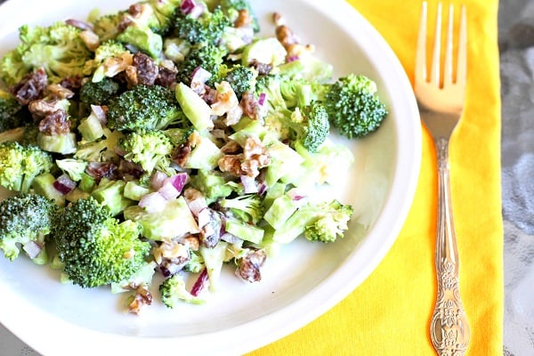 plate of broccoli salad with walnuts and dates