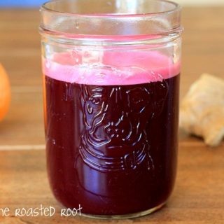 beet juice made using a blender instead of a juicer. Includes apple, orange, ginger, kale and coconut water
