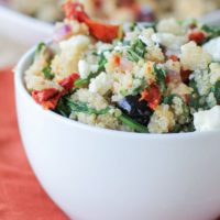 Mediterranean Quinoa Salad with spinach, kalamata olives, sun-dried tomatoes, feta, and lemon vinaigrette - a healthy vegetarian meal or side dish!