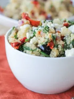 Mediterranean Quinoa Salad with spinach, kalamata olives, sun-dried tomatoes, feta, and lemon vinaigrette - a healthy vegetarian meal or side dish!
