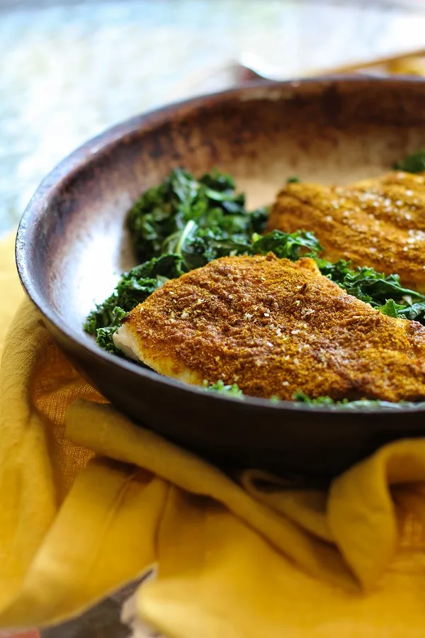 Curry-Spiced Sole with Garlic Sautéed Kale | https://www.theroastedroot.net