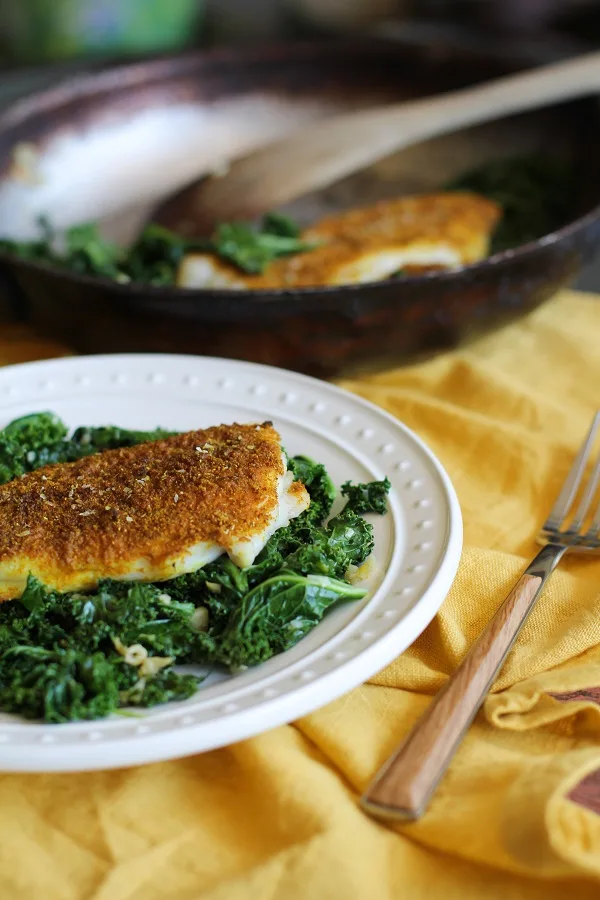 Curry-Spiced Sole with Garlic Sautéed Kale | https://www.theroastedroot.net