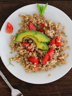 Heirloom Tomato and Avocado Farro Salad with Lime-Mint Dressing | https://www.theroastedroot.net