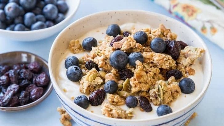 Grain-Free Paleo Granola made with nuts and seeds. This refined sugar-free recipe yields huge granola clusters and is super crunchy and delicious for breakfast