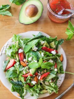 Baby Kale Salad with Strawberry-Mint Vinaigrette, goat cheese, walnuts, and avocado - a healthy and delicious summer salad recipe