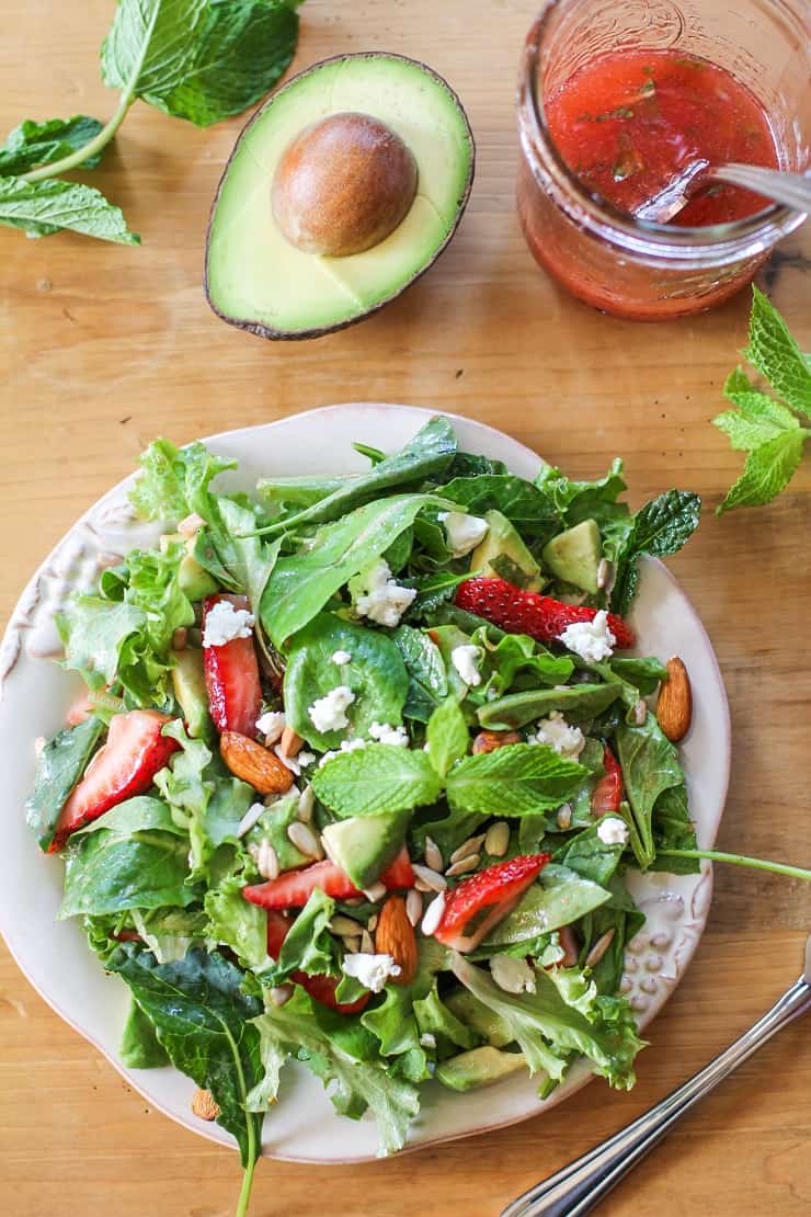 Baby Kale Salad with Strawberry-Mint Vinaigrette, goat cheese, walnuts, and avocado - a healthy and delicious summer salad recipe