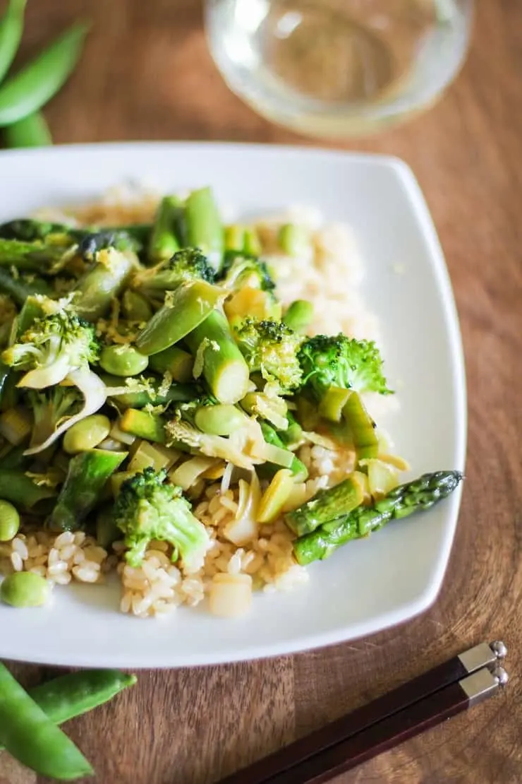 Spring Vegetable Stir Fry with Lemon Ginger Sauce, asparagus, leek, beans, and more. This healthy vegan dinner recipe is easy to prepare!