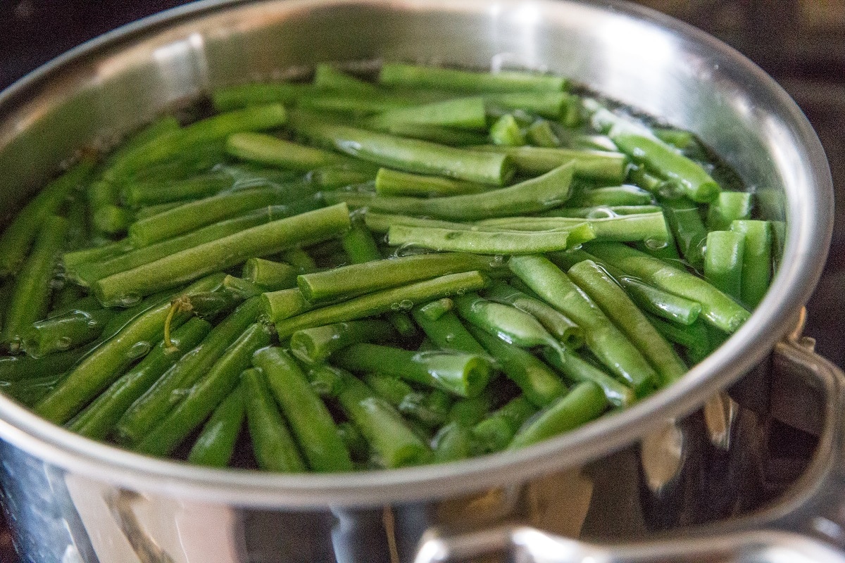 Green beans cooking in a saucepan