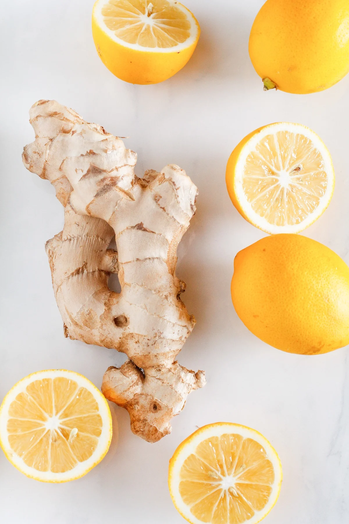 Ingredients for homemade ginger soda. Fresh ginger root and lemons