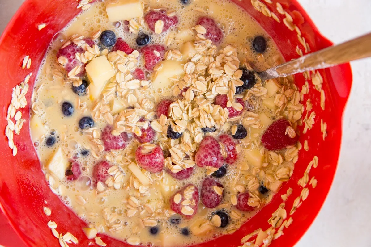 oat mixture for baked oatmeal in a mixing bowl
