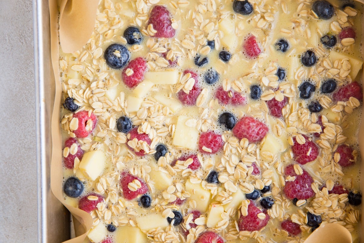 Oat mixture in a baking pan ready to be baked
