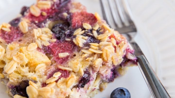 Sliced of Mixed Berry Baked Oatmeal on a plate, ready to be consumed