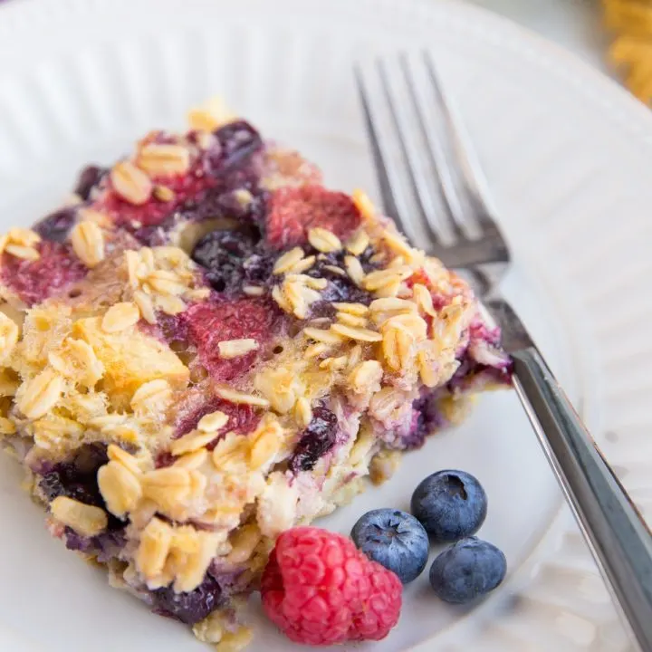 Sliced of Mixed Berry Baked Oatmeal on a plate, ready to be consumed