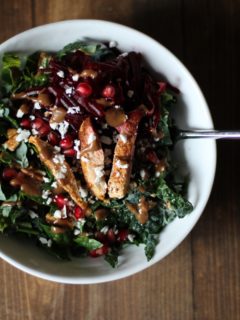 Chili Chicken Kale Salad with pomegranate seeds, pecans, goat cheese, and cinnamon dijon vinaigrette