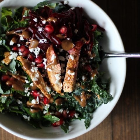 Chili Chicken Kale Salad with pomegranate seeds, pecans, goat cheese, and cinnamon dijon vinaigrette