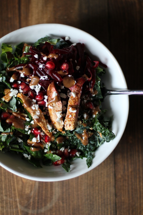 Chili Chicken Kale Salad with pomegranate seeds, pecans, goat cheese, and cinnamon dijon vinaigrette