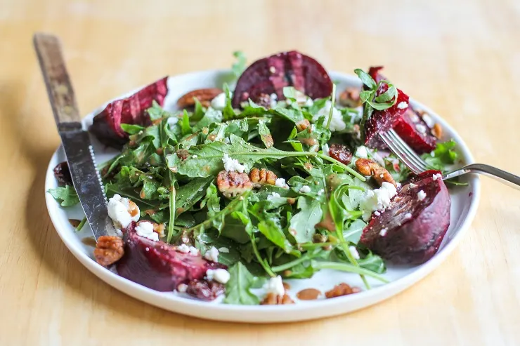 Roasted Beet Arugula Salad with balsamic vinaigrette, pecans, and goat cheese