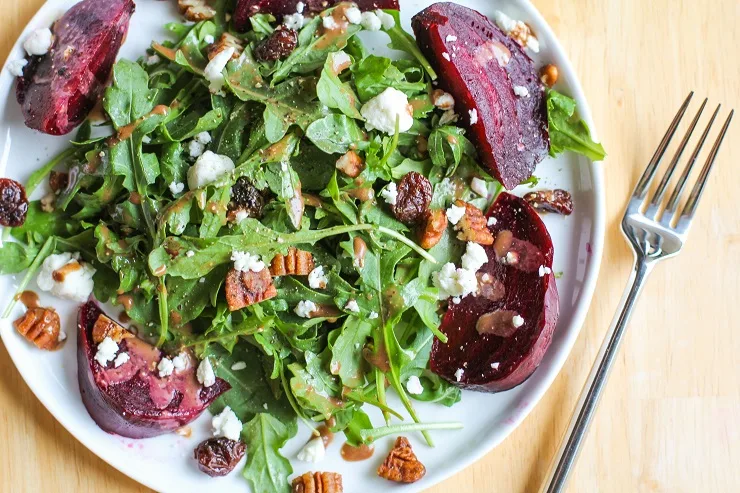 Roasted Beet Salad with Maple Balsamic Vinaigrette, candied pecans, cranberries, and goat cheese