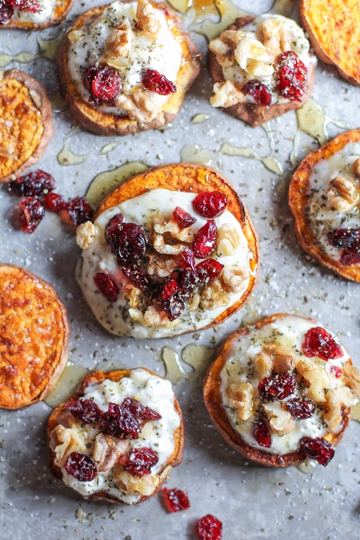 Sweet Potato Rounds with Herbed Ricotta Roasted Walnuts, Cranberries, and Honey | TheRoastedRoot.net an easy and healthy appetizer! #recipe #glutenfree #healthy #holiday