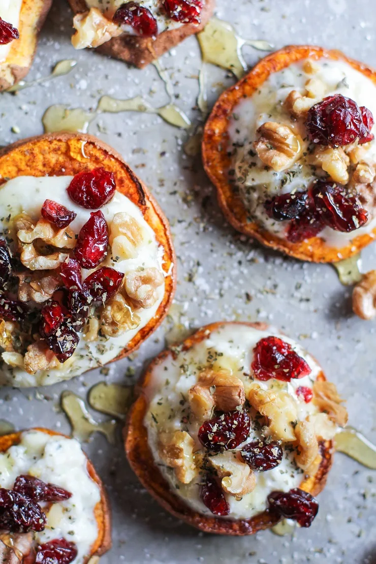 Sweet Potato Rounds with Herbed Goat Cheese, Roasted Walnuts, Cranberries, and Honey | TheRoastedRoot.net an easy and healthy appetizer! #recipe #glutenfree #healthy #holiday