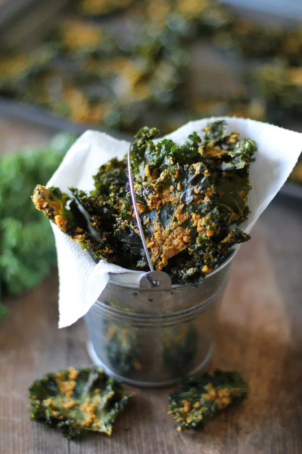 Nacho Cheese Kale Chips - Super crispy and addicting! Made with tahini and nutritional yeast #vegan #healthy #snack #recipe @bobsredmill 