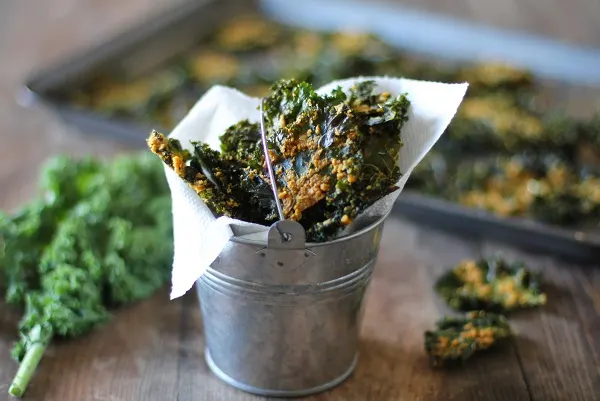 Nacho Cheese Kale Chips - Super crispy and addicting! Made with tahini and nutritional yeast #vegan #healthy #snack #recipe @bobsredmill 