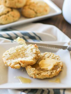 grain-free biscuit on a plate with butter and honey