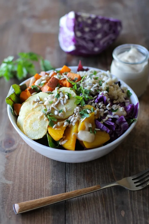 Roasted Root Vegetable Buddha Bowls with Maple Cinnamon Tahini Dressing | theroastedroot.net #vegan #recipe #eattherainbow