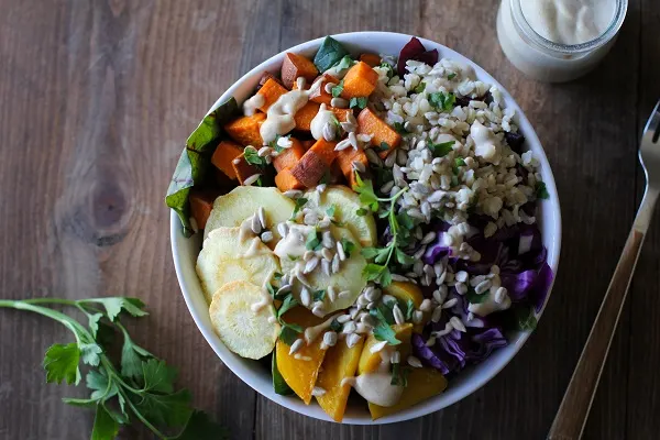 Roasted Root Vegetable Buddha Bowls with Maple Cinnamon Tahini Dressing | theroastedroot.net #vegan #recipe #eattherainbow