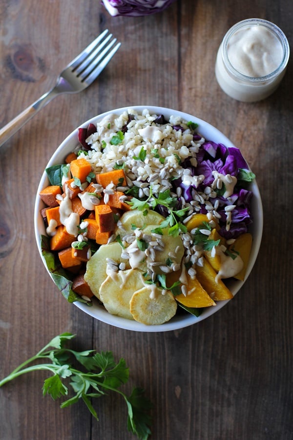 Roasted Root Vegetable Buddha Bowls with Maple Cinnamon Tahini Dressing | theroastedroot.net #vegan #recipe #eattherainbow