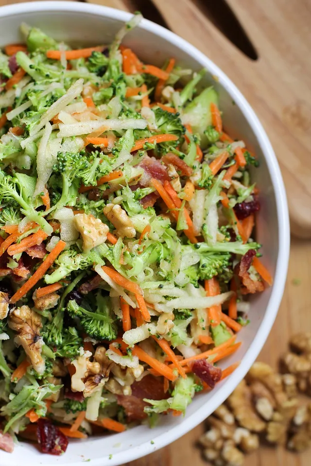 Grated Broccoli Salad with carrots, apples, dried cranberries, walnuts, and warm maple bacon vinaigrette.