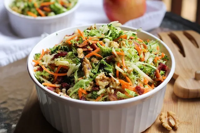 Grated Broccoli Salad with carrots, apples, dried cranberries, walnuts, and warm maple bacon vinaigrette. 