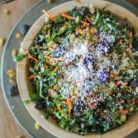 Kale Salad with Dried Cranberries, Pumpkin Seeds, Cotija Cheese, and Lemon Parsley Dressing