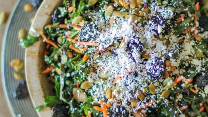 Kale Salad with Dried Cranberries, Pumpkin Seeds, Cotija Cheese, and Lemon Parsley Dressing