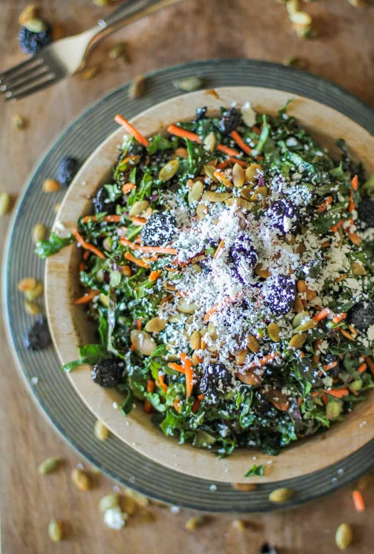 Kale Salad with Dried Cranberries, Pumpkin Seeds, Cotija Cheese, and Lemon Parsley Dressing