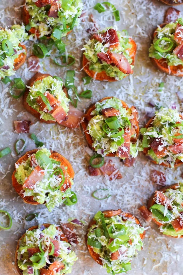 Roasted Sweet Potato Rounds with Guacamole and Bacon | theroastedroot.net #paleo #vegan #recipe #appetizer