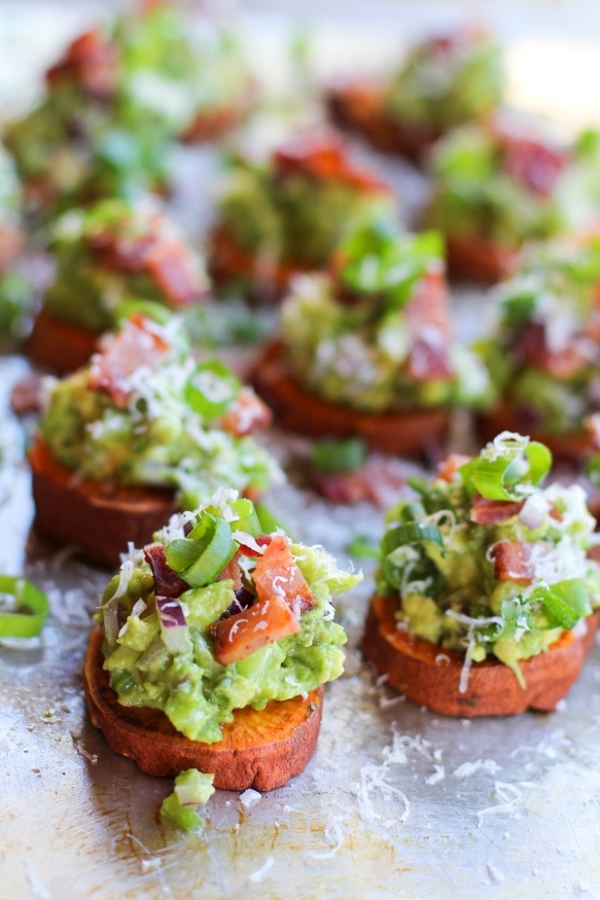 Roasted Sweet Potato Rounds with Guacamole and Bacon | theroastedroot.net #paleo #vegan #recipe #appetizer