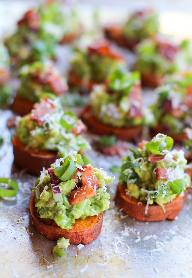 Roasted Sweet Potato Rounds with Guacamole and Bacon | theroastedroot.net #paleo #vegan #recipe #appetizer