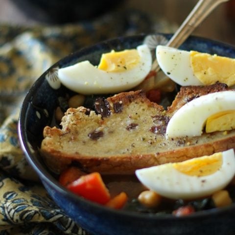 Tunisian Breakfast Soup - warmly-spiced soup with kale, chickpeas, and bell pepper, served with toasted bread and hard boiled egg #vegetarian #breakfast #recipe @theroastedroot