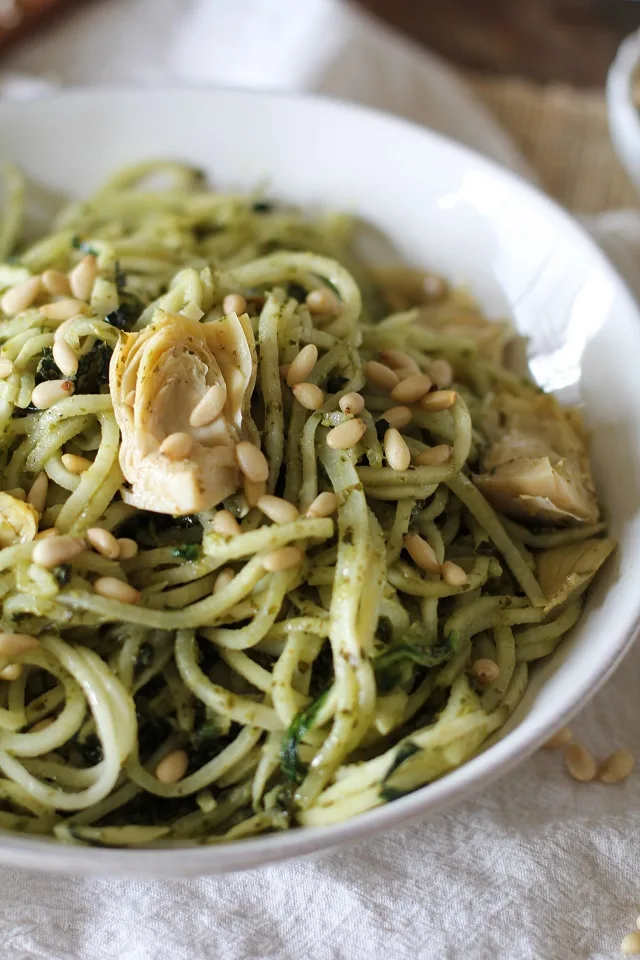 Turnip Pesto Pasta with Artichoke Hearts, Kale, and Pine Nuts - spiralize turnips for a comforting yet healthy meal! | theroastedroot.net #paleo #vegan #vegetarian #healthy #dinner #recipe @roastedroot