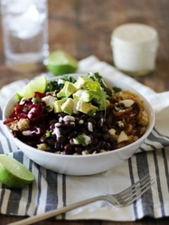 Quinoa, beet, and black bean burrito bowls with caramelized onions and cumin-lime tahini | theroastedroot.net #vegan #vegetarian #recipe #paleo #healthy @roastedroot