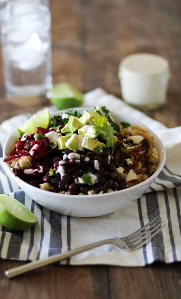 Quinoa, beet, and black bean burrito bowls with caramelized onions and cumin-lime tahini | theroastedroot.net #vegan #vegetarian #recipe #paleo #healthy @roastedroot