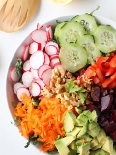 Spring Cleaning Detox Salad with kale, bell pepper, radishes, carrots, beets, avocado, walnuts, and lemon-parsley vinaigrette | theroastedroot.net #vegan #vegetarian #detox #salad #cleaneating #letthemeatkale