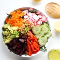 Spring Cleaning Detox Salad with kale, bell pepper, radishes, carrots, beets, avocado, walnuts, and lemon-parsley vinaigrette | theroastedroot.net #vegan #vegetarian #detox #salad #cleaneating #letthemeatkale