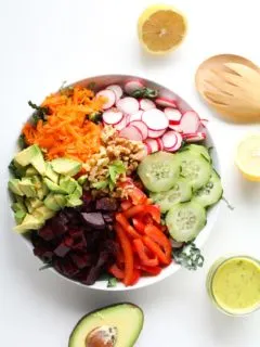 Spring Cleaning Detox Salad with kale, bell pepper, radishes, carrots, beets, avocado, walnuts, and lemon-parsley vinaigrette | theroastedroot.net #vegan #vegetarian #detox #salad #cleaneating #letthemeatkale