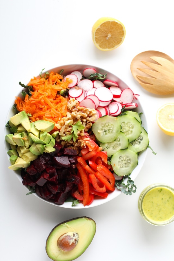 Spring Cleaning Detox Salad with kale, bell pepper, radishes, carrots, beets, avocado, walnuts, and lemon-parsley vinaigrette | theroastedroot.net #vegan #vegetarian #detox #salad #cleaneating #letthemeatkale